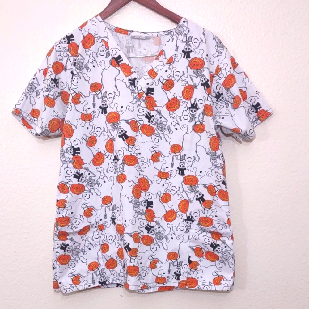 USED SCRUB TOP 2 POCKETS HAS MARK SIZE LARGE PUMPKIN, SKELETON AND GHOSTS